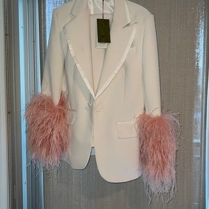 White suit pink feather